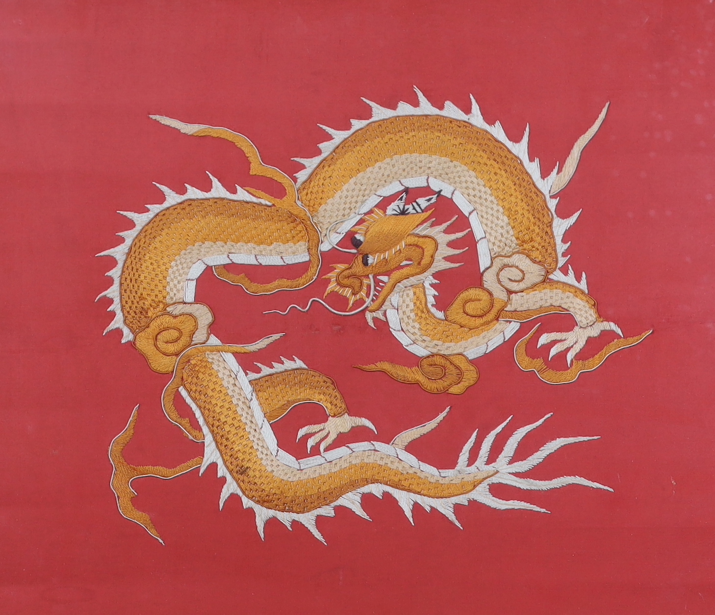A framed silk Chinese dragon embroidery, 47.5cm wide x 39.5cm high